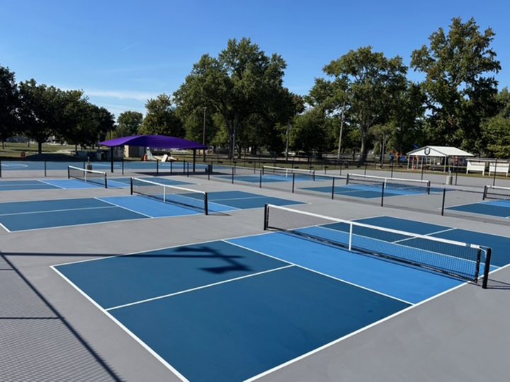 multiple resurfaced outdoor pickle ball courts using two blue colors