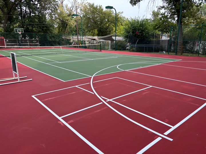 combination red and green resurfaced outdoor basketball and tennis courts